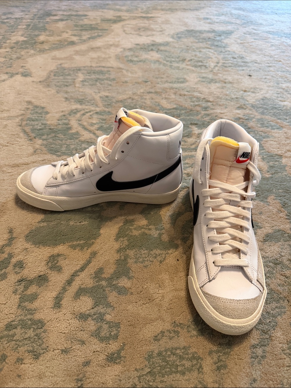 Nike White High-Top Sneakers with Black Swoosh